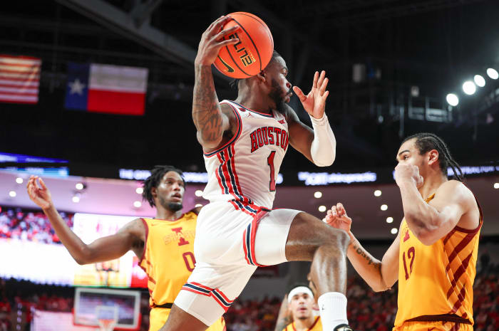 Houston guard Jamal Shead (1) looks to pass the ball during the second half against Iowa State at Fertitta Center in Houston on Feb. 19, 2024.